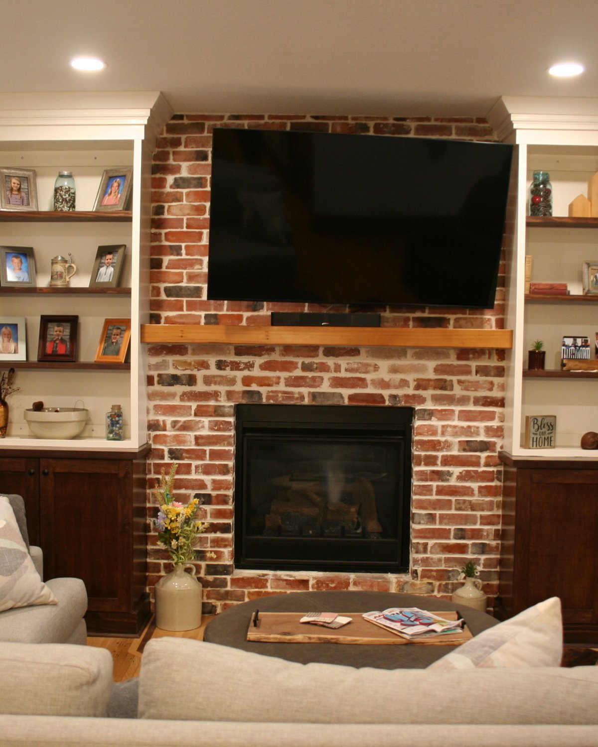Stained barn door and matching beverage cabinet with an integrated cooler